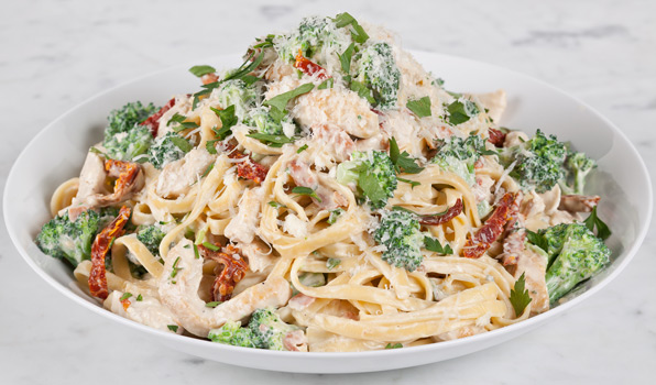 in the kitchen with stefano faita creamy chicken and broccoli pasta with grated parmesan cheese, parsley, thin slices of pancetta and chicken scallopine