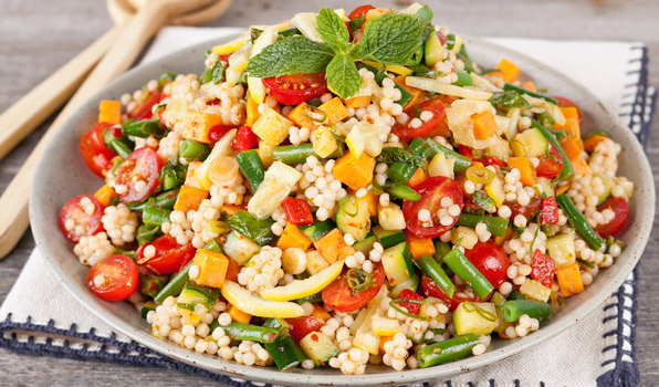 in the kitchen with stefano faita veggie couscous salad with harissa dressing served in a dish