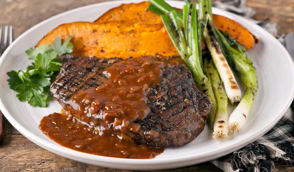 in the kitchen with stefano faita spicy rib eye steaks with maple coffee sauce served with baked sweet potatoes and grilled green onions