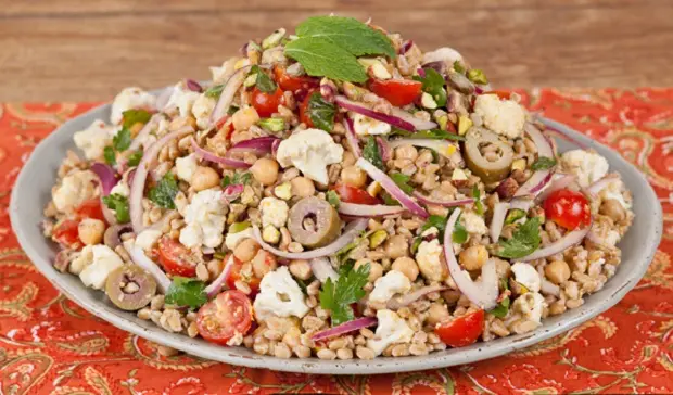 in the kitchen with stefano faita farro and chickpea salad with pistachio dressing displayed on a plate